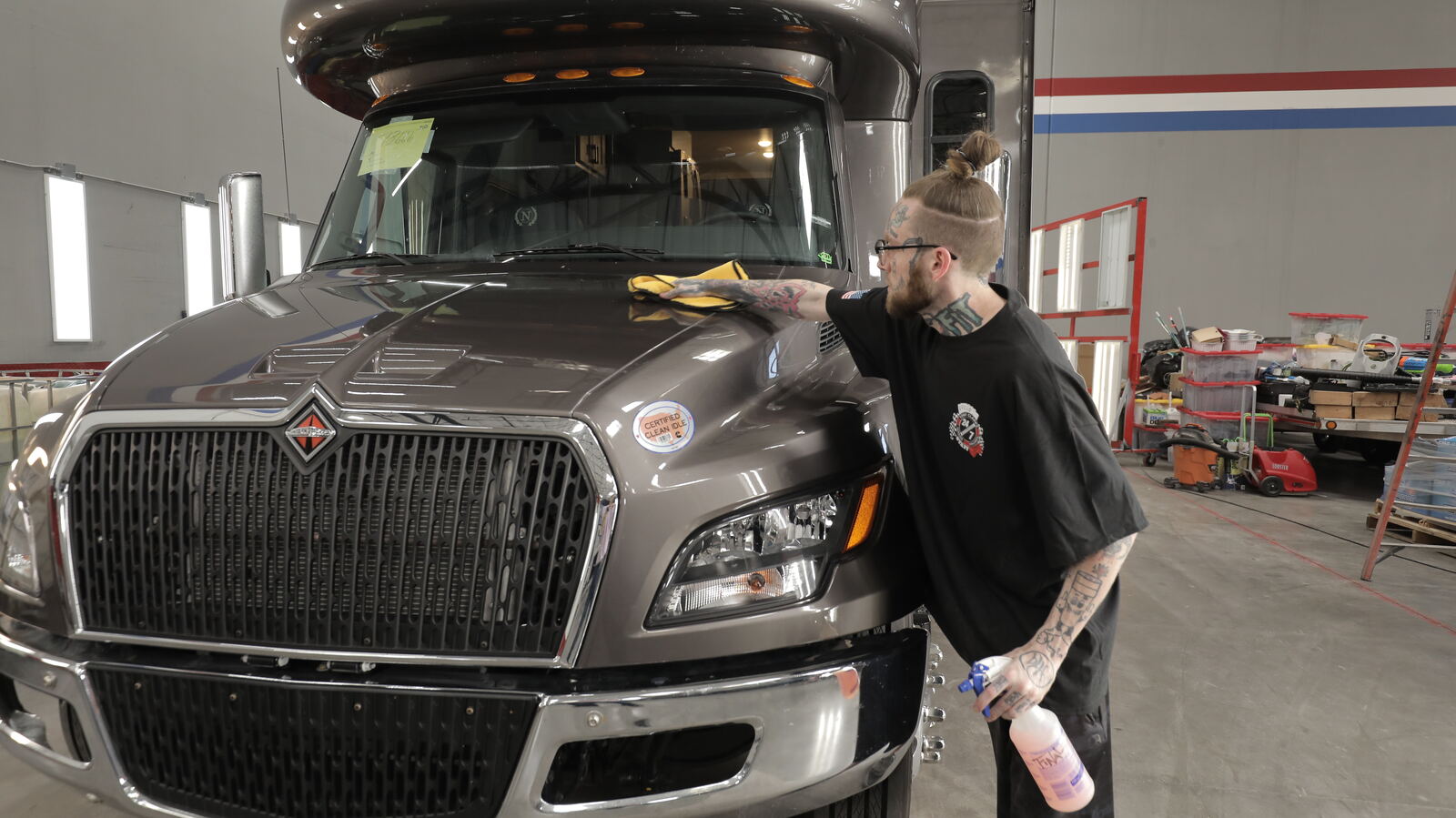 Ceramic coating being applied to a motorcoach panel